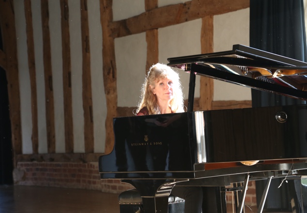 Sue playing the piano